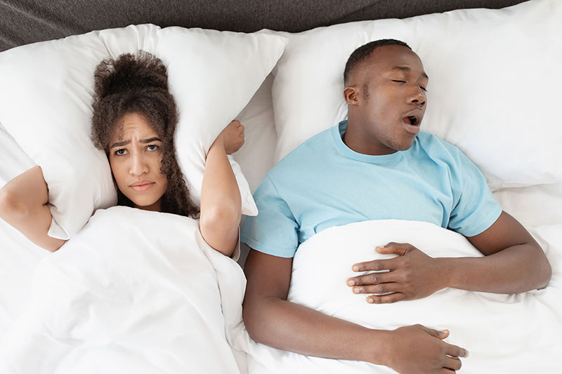 woman can't sleep next to her snoring husband